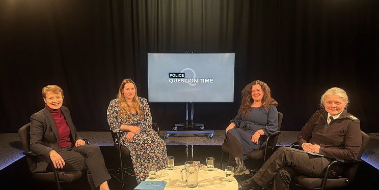 PCC Clare Moody is sitting down in a darkened studio with panellists Laura, Sarah and Sarah, with a screen saying Police Question Time in the background